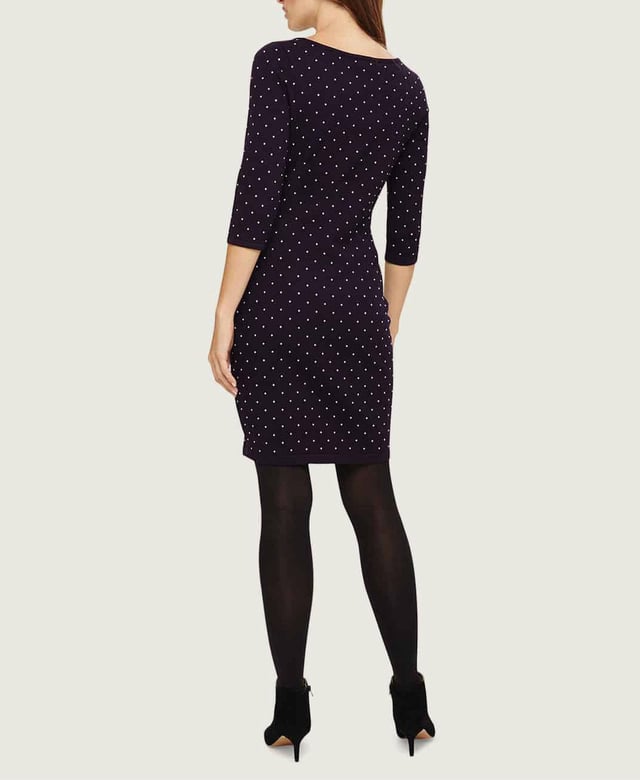 A fitted knit dress that falls above the knee, designed with a scoop neckline and 3/4 length sleeves. This style has stud detailing and can be worn with or without tights.
Fit: Stretch Fit, Sizing: As expected