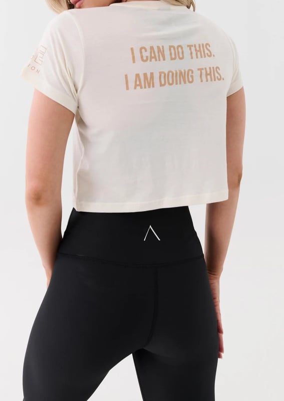 Slightly relaxed fit tee in a cropped length. Fine ribbed neckline. KAAIAA flat rubber logo and P.E Nation flat rubber logo on sleeve