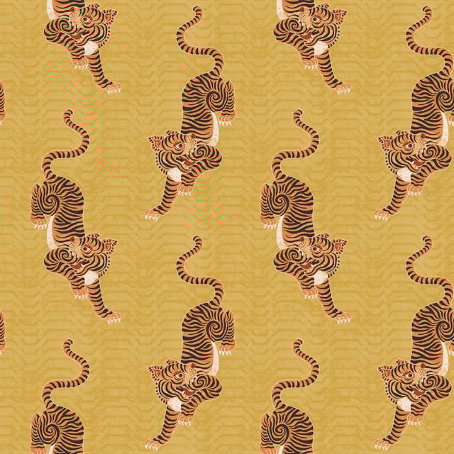 Add instant personality into your home with this showstopping Tibetan Tiger wallpaper featuring a tribal-inspired design and crawling tigers. The striking orange tiger contrasts on a bold mustard backdrop, adding dimension and flair to this beautiful wallpaper. This wallpaper is a paste the wall application; simply paste the wall, hang your paper, and leave to dry. Each roll is 10m long and 52cm wide. Pattern repeat: 53cm Straight Match. Our Tibetan Tiger wallpaper can be used to paper the whole room or to create an eye-catching feature wall. This wallpaper is also wipeable so that any light marks can be dabbed away.
