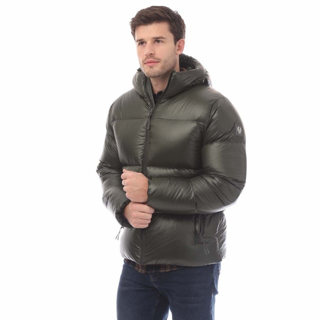 Mens Belstaff Down Filled Ripstop Resolve Jacket in green.- Hood and hem drawcord.- Water resistant centre front zip.- Zip fastening hip pockets.- Silicone phoenix badge on left sleeve.- High-shine  100% recycled nylon in a micro ripstop construction.- High performance  lofty  ultralight and highly insulating down jacket style.- Water repellent.- 750 fill power down.- 100% RDS certified down and feather (IDFL CERT TE-00103785) with PFAS free water-repellent finish.- High-shine  100% recycled nylon in a micro ripstop construction.- 100% Polyamide.- Ref: 105161TLGRN