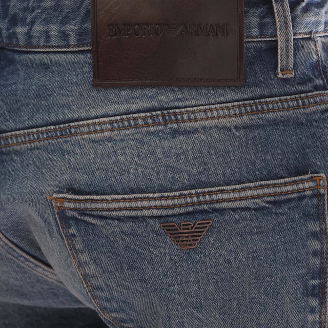 Mens Emporio Armani J06 Slim-Fit Washed Jeans in blue.- Five-pocket styling.- Zip fly and button fastening.- Belt loops.- Leather brand patch.- Metal rear pocket eagle.- Slim fit.- 99% Cotton  1% Elastane.- Ref: 6D1J061D67Z942