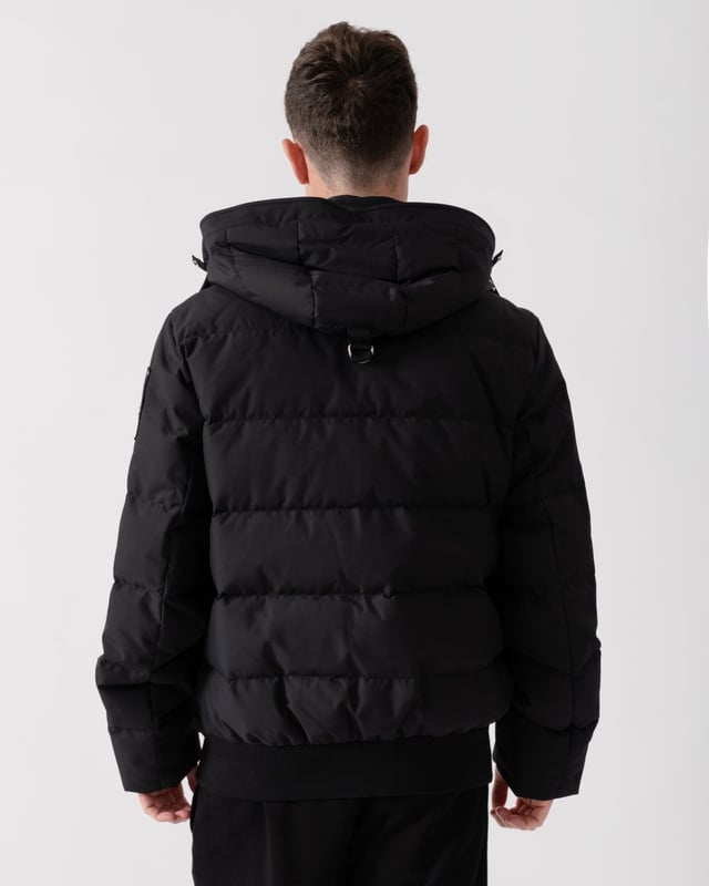 The Cloud Bomber boasts a 30% weight reduction compared to Moose Knuckles Originals, providing lasting warmth without added bulk. Crafted from lightweight shell and RDS-certified 90/10 down fill, it features a hollow frame logo for maximum warmth in a lightweight package. Its removable lamb shearling-trimmed hood adds versatility, while heat-retaining brushed pockets at the front enhance functionality.


Warmth & Protection


Protection Rating - Level 3: Crazy Cold – Heavy and durable, choose these garments when the cold gets serious.
800 Fill Power
Toscana Shearling on Trim
Water Repellent, Water Resistant, Wind Resistant




Design & Function


Capuchon amovible
Down Filled Collar
2- Way Zipper with Logo Puller
2 Pockets with Zipper Closure on Chest2 Pockets with Zipper Closure below Waist
Rib Knit Cuffs and Hem
Black Nickle Metal Logo


COMPOSITION



Body: 100% Polyester
Lining: 100% Polyester


FILL

90% Duck Down 10% Feathers
 
M34MB005S


 



 



 