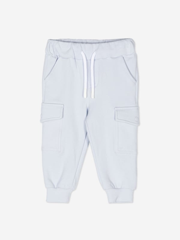 Introducing the Baby Boys Cargo Trousers in Blue from patachou, a luxurious addition for AW2024. Crafted with precision, these trousers are a perfect blend of elegance and comfort for your little one. Key highlights:‚ Rich Blue Hue: A deep, captivating blue that complements any outfit.‚ Premium Fabric: Constructed with high-quality materials for durability and comfort.‚ Versatile Design: Featuring practical cargo pockets and a stylish, adaptable fit.Elevate your child's wardrobe with these chic and functional cargo trousers!
