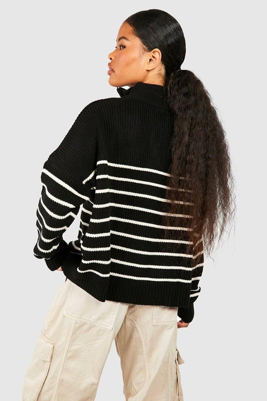 Half-zip neckline for adjustable coverage
        Bold striped pattern for eye-catching style
        Relaxed, oversized fit for ultimate comfort
        Ribbed cuffs and hem for a snug finish
        Versatile design suitable for various casual occasions
    
    Make a statement in this striking striped jumper, perfect for the fashion-forward petite woman. The half-zip neckline adds a sporty touch while allowing you to customise your look. Its relaxed, oversized silhouette offers both style and comfort, ideal for those laid-back days when you want to look effortlessly chic. Pair it with wide-leg trousers and trainers for a trendy casual ensemble, or throw it over a midi skirt and ankle boots for a more put-together look. Whether you're meeting friends for coffee or heading to a family gathering, this jumper is your go-to piece for versatile, on-trend style. The bold stripes and cosy knit fabric make it a standout item in your wardrobe, ready to take you from season to season with ease.