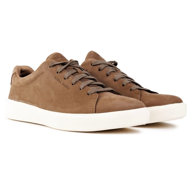 Mens brown Cole Haan grand crosscourt traveler trainers, manufactured with leather and a rubber sole. Featuring: cushioned footbed, durable rubber cupsole, soft leather upper, cole haan branding and comfort fit.