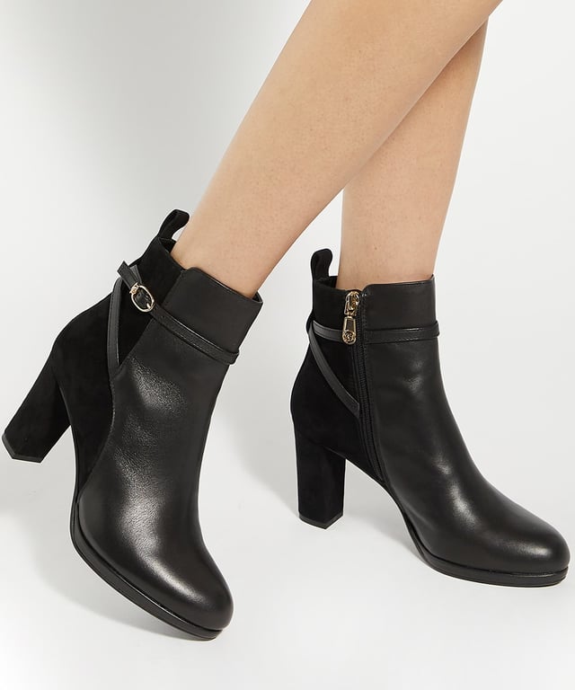 Dune Ladies Ottara - Branded Buckle Heeled Ankle Boot Set on a high heel, Ottara is an ankle boot that will fit effortlessly into your selection of style staples. From its rounded toe to the branded DD buckle, it offers a sleek and comfortable fit, making it a versatile choice for both day and evening wear.