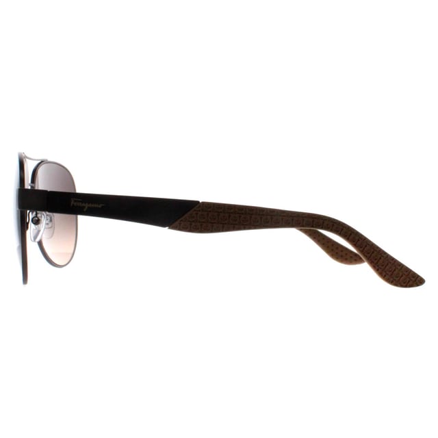 Salvatore Ferragamo Aviator Mens Matte Dark Ruthenium Grey Brown Gradient SF275S  Sunglasses exude luxury and elegance, embodying the refined craftsmanship for which the brand is known. These sunglasses feature a bold, aviator frame that makes a sophisticated statement, seamlessly blending modern design with timeless appeal. Made from high-quality metal , the SF275S offers durability and comfort, while the lenses provide full superb UV protection to shield your eyes from harmful rays. The subtle Ferragamo logo accents on the temples add a touch of understated opulence, making these sunglasses the perfect accessory for those seeking both fashion-forward style and premium functionality.