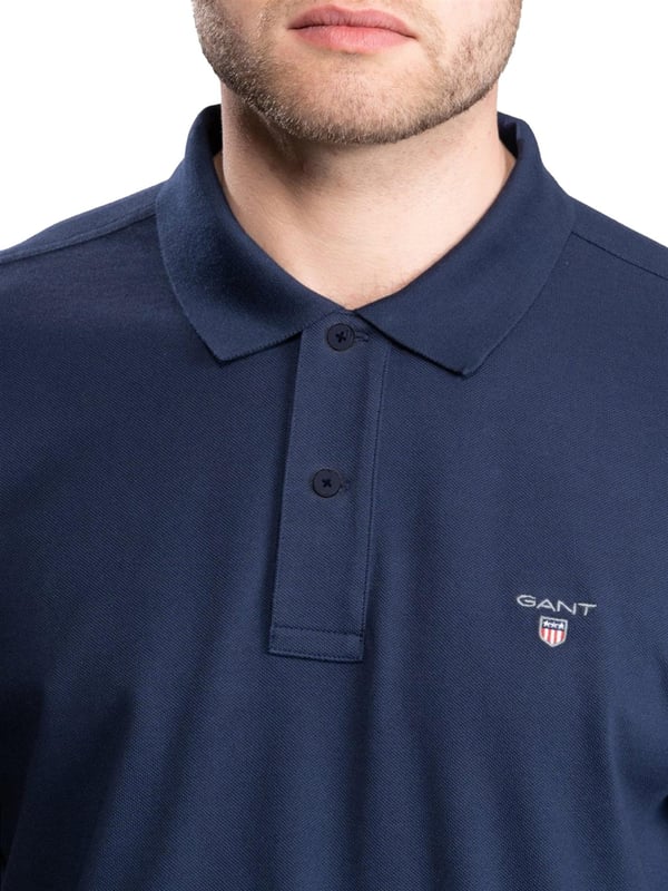 Gant Mens Designer Long Sleeve Polos feature the brands Logo, a Button-Down Collared Neckline. Crafted With 100% Cotton, these Lightweight and breathable Regular Fit Polos are Suitable for Casual or Workwear.