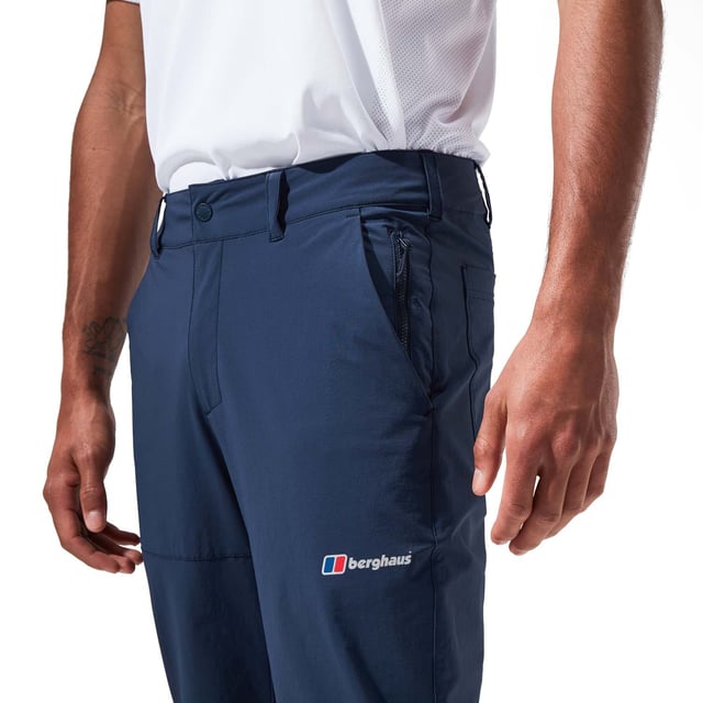 Men's Berghaus Tetratrack Pants in dark blue.- Snap closure on the waist.- Zipped hand pockets.- Side pockets.- Belt loops.- Toggles at the leg.- The DWR face fabric ensures droplets bead on the surface of the fabric, giving water resistant protection.- With more than 50% recycled content and more than 90% bluesign® APPROVED fabric, this product meets our MADE KINDER criteria which helps ensure that our gear is more responsibly made. Ref: 4A001414R14.
