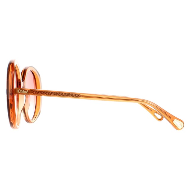 Las gafas de sol Chloe Oval gradiente naranja oscuro transparentes Ch0007S para mujer son un glamuroso modelo ovalado elaborado en acetato ligero. El logotipo de Chloe está grabado en las patillas para mayor autenticidad.
