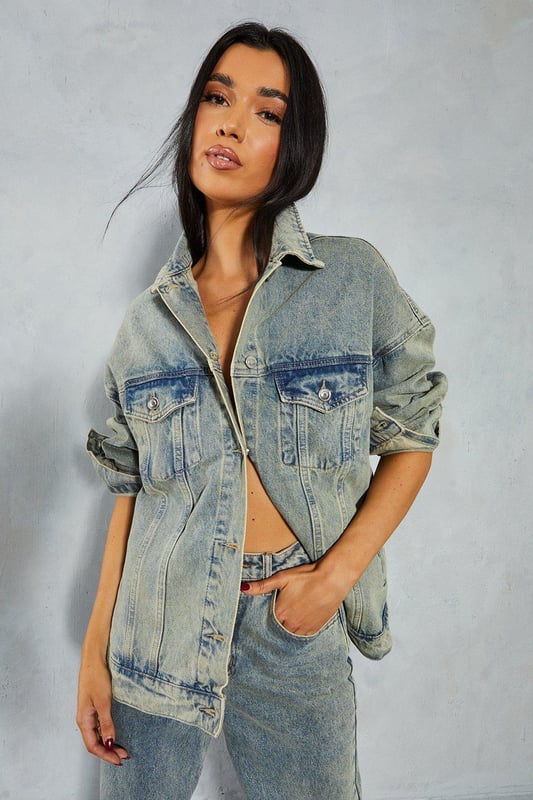 Oversized fit with dropped shoulders 
 Button front closure 
 Long sleeves with button cuffs 
 Chest pockets and welt hand pockets 

This denim oversized jacket from Misspap offers an effortlessly cool look. Crafted from cotton-rich denim in a stone washed finish, the jacket features an on-trend oversized silhouette with dropped shoulders and a relaxed fit through the body. Style with skinny jeans or leggings and a cropped top to balance the oversized shape. For cooler weather, layer over a chunky knit sweater. The versatile denim fabric and classic detailing make this an easy jacket to dress up or down. Throw it on over a slip dress and heeled sandals for drinks with friends or pair with trainers for a casual daytime look. With its slouchy borrowed-from-the-boys vibe, this jacket brings a laidback edge to any outfit. The stone wash gives it a lived-in, vintage appeal that reflects the Misspap aesthetic. A modern classic, it has the versatility to become a wardrobe staple for seasons to come.