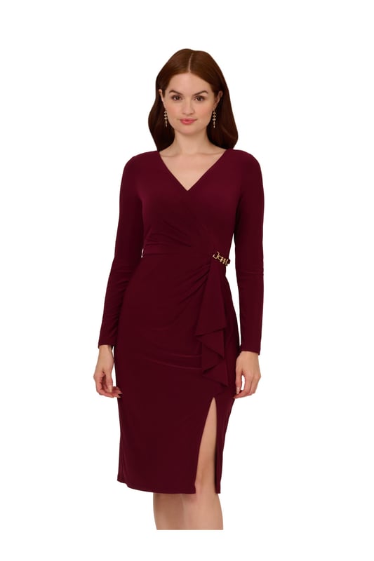 Make your biggest moments even more memorable when you step out in this long sleeve dress. This dress features a faux wrap silhouette, v-neckline, and long sleeves. Designed with ribbed jersey fabric that has tons of stretch, this midi dress has a draped detail at the waist and is accented by chain trim on both sides of the design. Elevated yet appropriate for every day, this jersey dress has a hidden zipper closure at the back and a slit at the skirt. From a day at the office to date night, this long sleeve dress will look lovely no matter the occasion.