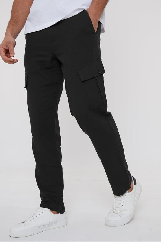 Upgrade your wardrobe with these linen blend cargo trousers from Threadbare. These linen mix cargos are the perfect blend of comfort and style, and with a part elasticated waistband with drawcords, they hit the laidback luxe trend with ease. Cut in a regular fit with a twin needle stitched hem, belt loops, mock horn button and zip fly closure. Linen-rich, these trousers will keep you cool and comfortable all day long, and have two side pockets, two back pockets, along with a button closure pocket on each leg. Team with a casual shirt to complete the look.
