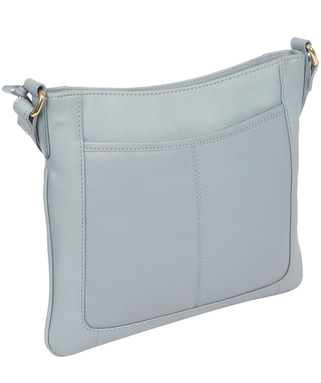 The 'Lewes' cross body bag from Pure Luxuries London, is crafted from naturally milled leather with a beautifully distinct fine-grain feel. A zip-over top secures a gorgeous, 100% natural cotton-lined interior with two slip pockets. On-the-go storage comes in the form of an exterior zipped pocket and two slip pockets, complemented by an adjustable and matching leather shoulder strap. Furnished with gold coloured metal fittings and the elegant Pure Luxuries London charm and logo plate.