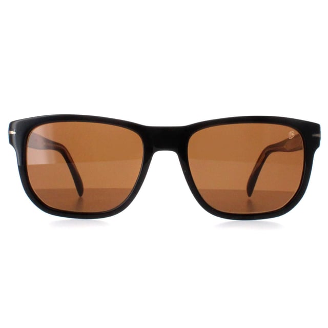 David Beckham Rectangle Mens Black Brown DB1045/S  Sunglasses are a fusion of unparalleled sophistication and modern edge. Designed to reflect Beckham's iconic style, these sunglasses feature a bold frame that exudes confidence and charisma. The sleek lines and subtle branding create a refined aesthetic, while the lenses provide optimal protection against harsh rays while maintaining impeccable clarity. Whether you're on a bustling city street or soaking up the sun on a tropical getaway, these unglasses are the perfect accessory to elevate your look and command attention with every wear.