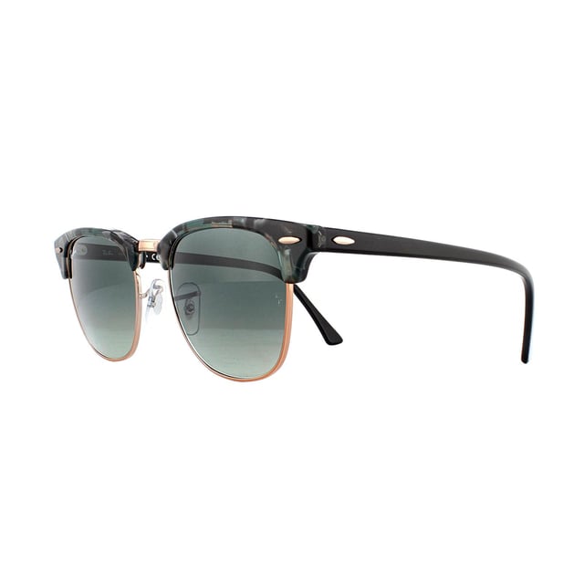Ray-Ban Sunglasses Clubmaster 3016 125571 Spotted Grey Green Dark Grey Gradient were designed in 1986 and are inspired by the 50s and 60s lifestyle. The Ray-Ban Clubmaster are an intellectual retro style that feature curved lenses, elegantly tapered arms and vintage pin hinges. The top half of the full rimmed lenses are enclosed by a bold acetate frame and this design feature creates a strong brow line that is sure to make you stand out from the crowd. The frame is lightweight and the adjustable nose pads create a personalised and comfortable fit. The Clubmaster is a timeless design that Ray-Ban continue to adapt with the use of colour to add a contemporary feel to the vintage style.