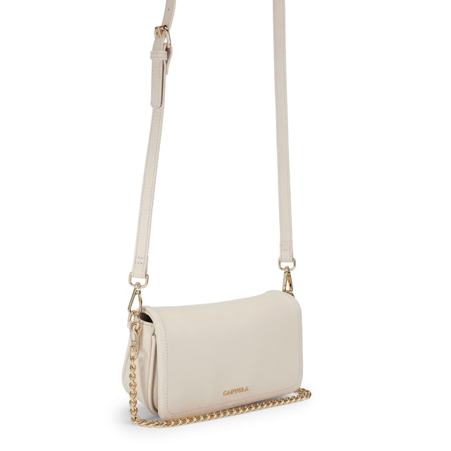 The Carvela Como Chain Shoulder bag features a bone exterior with pebble grain texture. There is gold tone hardware across the bag and branding on the front. Dimensions: 13cm (H), 21cm (L), 6cm (D). Strap length: 124cm.