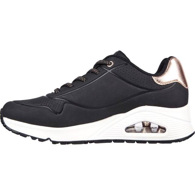 Slip-on a classic style in comfort wearing Skechers Street Uno - Shimmer Away. This fashion sneaker features a synthetic durabuck upper with a metallic trim, stretch laces, Skechers Air-Cooled Memory Foam insole and Skech-Air visible airbag midsole.