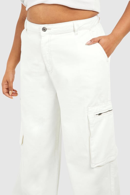 Wide-leg silhouette for a relaxed, on-trend look
        Cargo-style pockets add functional flair
        High-waisted design for a flattering fit
        Denim fabric offers durability and comfort
        Plus-size fit ensures inclusive styling
    
    Make a bold statement with these ecru cargo jeans, perfect for the fashion-forward woman who values both style and comfort. The wide-leg cut creates a relaxed silhouette that's right on trend, while the high-waisted design accentuates your curves in all the right places. Cargo pockets add a utilitarian edge, making these jeans as practical as they are stylish. Pair them with a cropped top and oversized coat for a chic, layered look that's ideal for casual outings or family gatherings. For a more laid-back vibe, team with a simple tee and trainers. The versatile denim fabric ensures these jeans will become a go-to piece in your wardrobe, easily transitioning from day to night with a simple change of accessories. Embrace the cargo trend and showcase your unique style with these must-have jeans from Boohoo.