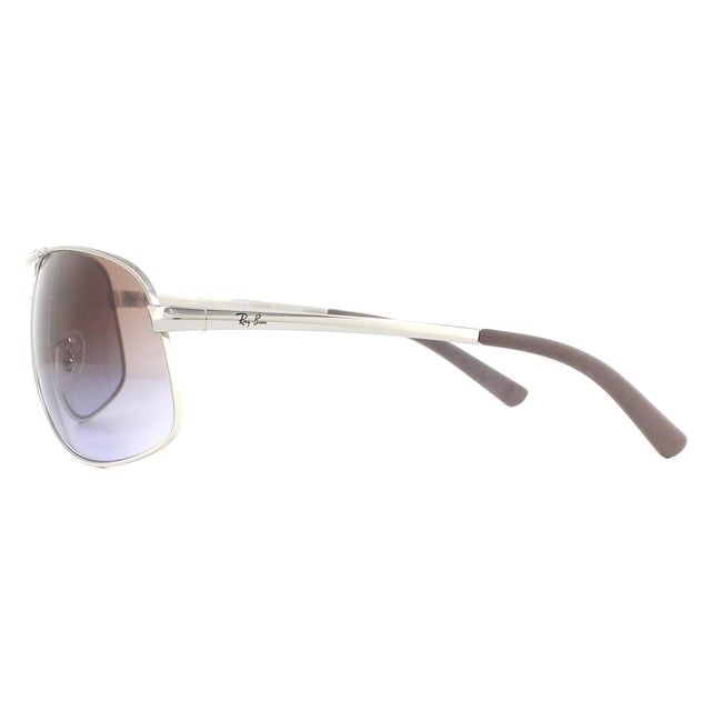 Las gafas de sol Ray-Ban RB3387 003/68 Silver Brown Gradient son una versión más grande de las clásicas gafas de piloto Ray-Ban. Estas tienen un brazo mucho más ancho con la clásica forma de aviador.