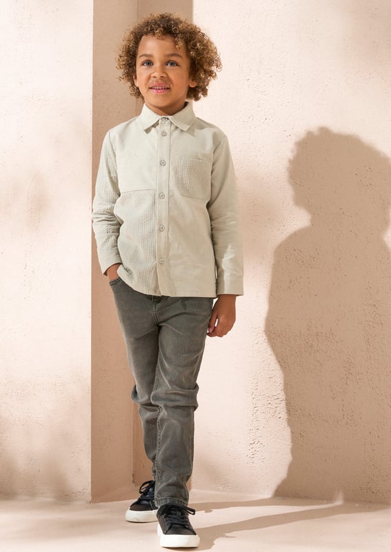 An A&R twist on the classic shirt. A clever mix of cut and sew textured and plain panels in soft sage green. this long-sleeved shirt features a classic silhouette and a button placket. A versatile piece that can be dressed with chinos or shorts and worn w.