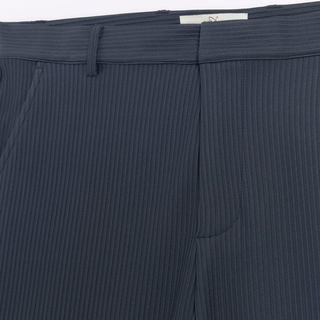 Tapered fit, Pleated fabric, Side slip pockets, Belt loops, Concealed zip and button fastening