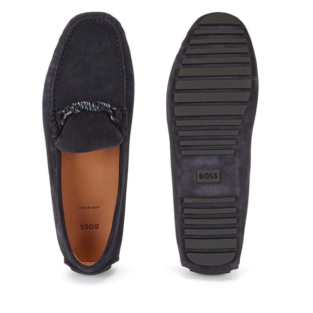 Men's Boss Driver Moccasin Shoes in Dark Blue Mens BOSS Driver Moccasin Shoes in dark blue.- Made in Italy.- Full suede upper design for a casual look.- Trimmed with seasonal chord hardware on the vamp. - Rubberised injected outsole and a cognac-leather lining delivers elevated comfort in every step.- Ref: 50472511-401