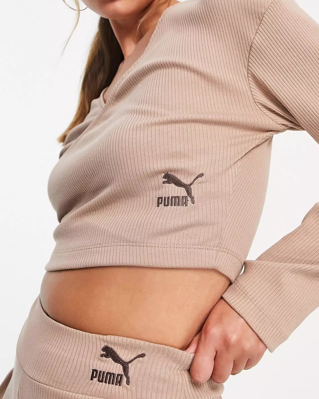 Wrap front long sleeves logo embroidery to side cropped length and regular fit.