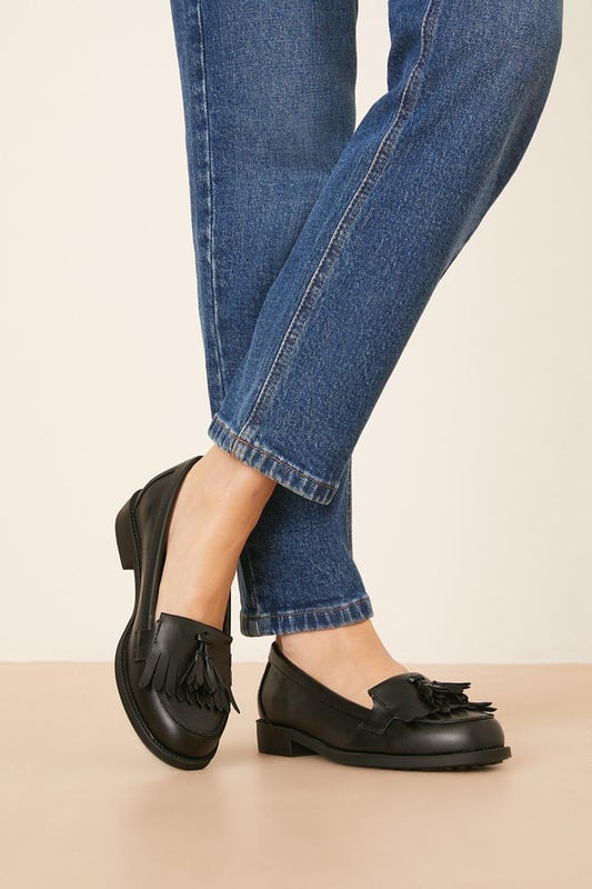 Whether you're dressing up for a formal occasion or looking to elevate your everyday style, this loafer is the perfect choice. Step out in confidence and make a statement with our timeless fringed tassel loafer.