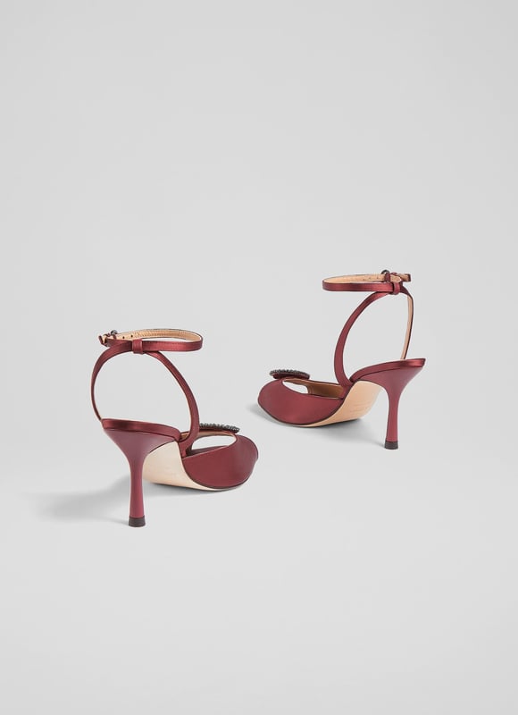 LK Bennett Belle Formal Sandals, Burgundy An elegant and timeless take on a party sandal, our Belle sandals have a glamorous, vintage feel. Crafted from lustrous burgundy satin, they're a peeptoe style with a sparkling, oval-shaped crystal buckle embellishment, a delicate ankle strap and a shapely stiletto heel. Wear them with your favourite party dresses or to instantly dress up a pair of tailored trousers.