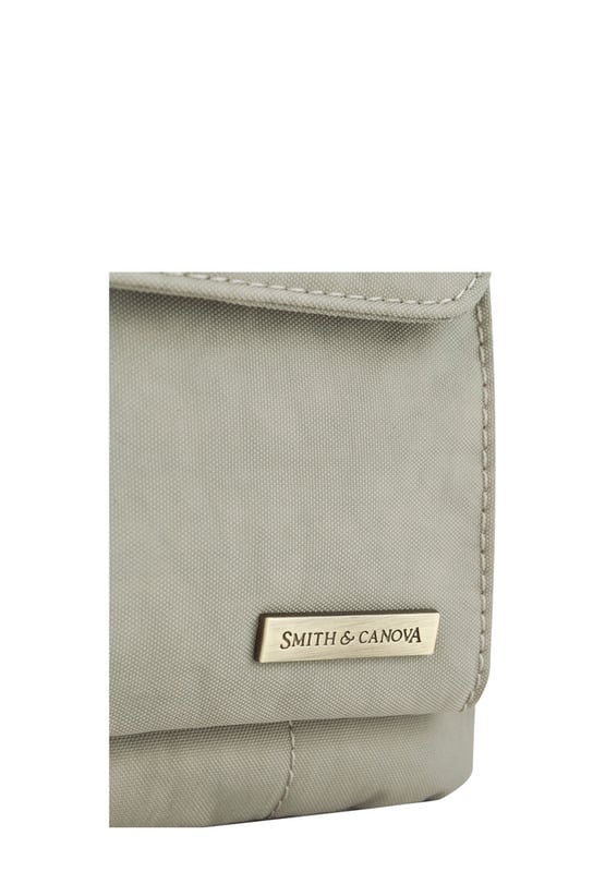 The perfect daily companion for carrying all your essentials. The Portrait Nylon Crossbody Bag features two internal main compartments, a flap over zip pocket to the front and fully adjustable strap with a clip off function. Features: , Zip top opening, Front flap over zip pocket, Rear zip pocket, SMITH & CANOVA antique brass logo, Branded antique brass zips, Adjustable crossbody strap (detachable), Two internal main compartments, Internal zip pocket Style Ref: 92685 STONE