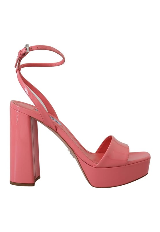 Brand: PRADA
  Condition: Brand new with tags
  Model: Block heels platform sandals
  Color: Pink
  Material: 100% patent leather
  Leather bottom sole for durability
  Logo details showcasing the iconic PRADA brand
  Made in Italy with high craftsmanship
  Exclusive and luxurious design
  Perfect for fashion-forward women
Material: 100% patent leather