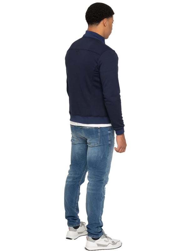 Enzo Milano Mens Hybrid Jacket features a puffer front made from lightweight polyester, which provides excellent insulation. Full zip fastening front with a elasticated collar, long contrast-fabric sleeves with elasticated cuffs. The jacket has 2 secure zip-fastening pockets, 2 inside pockets for additional storage. Finished with Enzo Milano rubberised branding on the left sleeve.