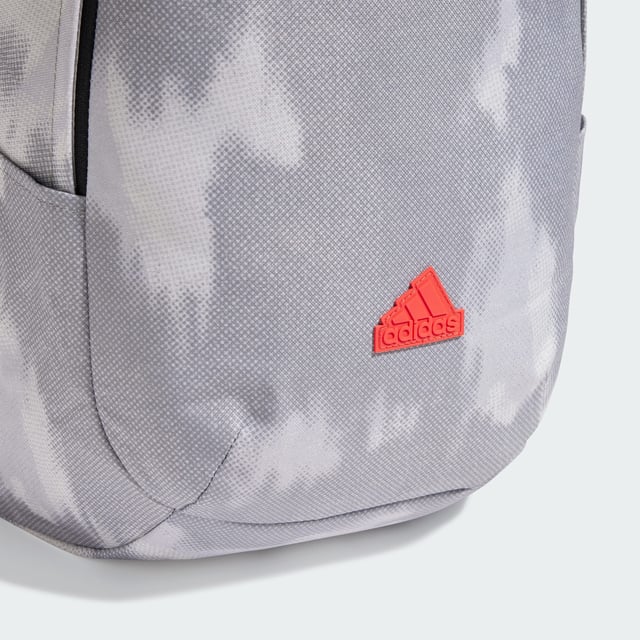 Weaving through city streets or escaping to the countryside, the adidas backpack makes a stylish yet practical choice. Padded, adjustable straps and a breathable mesh back panel ensure carrying comfort wherever the day takes you. Multiple pockets, inside and out, provide storage for life's essentials. This product is made with at least 50% recycled materials. By reusing materials that have already been created, adidas help to reduce waste and our reliance on finite resources and reduce the footprint of the products adidas make.  - Dimensions: 14.5 cm x 31 cm x 45 cm - Volume: 20.2 L - 100% polyester (recycled) - Mesh back panel and strap backing - Front zip pocket - Slip-in side pockets - Inner slip-in pocket - Padded adjustable shoulder straps - Carry handle  Shipped by adidas