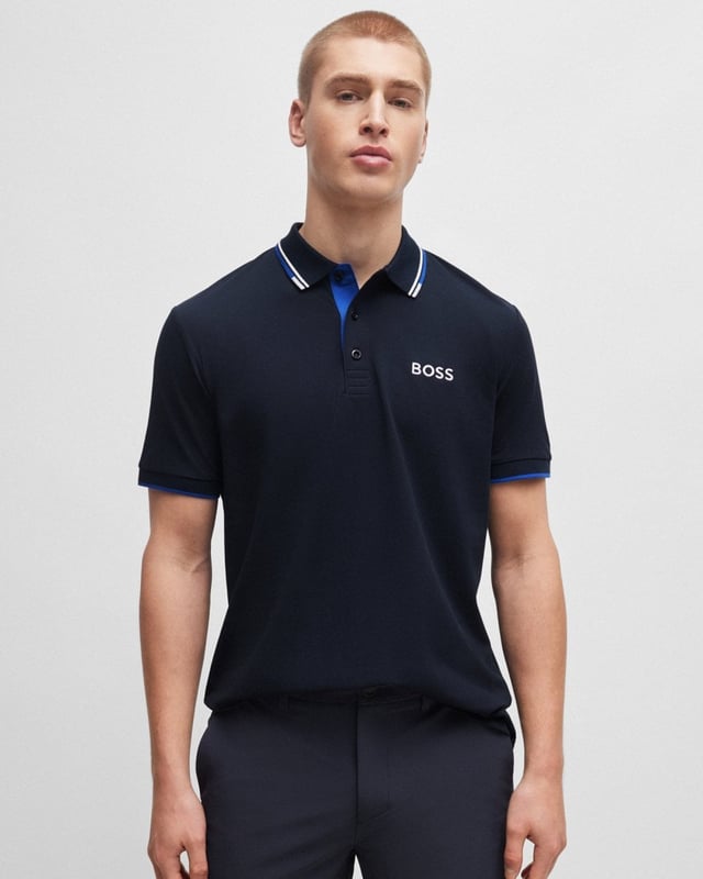 A distinctive polo shirt cut to a regular fit, by BOSS Menswear. Featuring contrast branding at the left chest and back neck, this short-sleeved polo shirt is designed in cotton-blend fabric with S.Café® and stretch for casual comfort. 3D stripes add a sporty touch at the collar and cuffs.
Regular fitFlat-knit collarNumber of buttons: 3Short sleevesFlat-knit cuffsStandard length
56% Cotton, 39% Polyester (recycled) , 5% Elastane
50469102
 