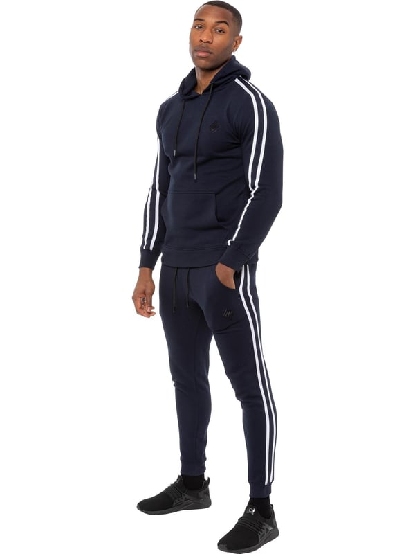 Enzo Mens Tape Hoodie Full Overhead Tracksuit. Overhead Hooded Top. Enzo Embroidery Logo on Chest and Contrast Stripe Design on Sleeves. Hoodie with Drawstring. Ribbed Waist and Cuffs. Kangaroo Pockets. Enzo Mens Casual Designer Striped Tracksuit Joggers. Featuring Classic Contrast Stripes to Sides. 2 Side Pockets. Cotton Blend for Superior Comfort. Adjustable Waist with Drawstrings. Athleisure Perfect for All Gym wear