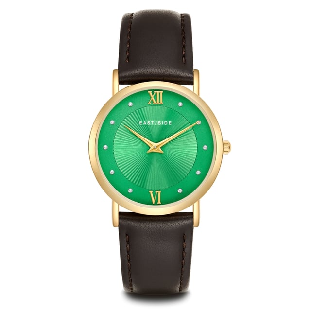 GENERAL INFORMATION:  • Targetgroup: Female  • Wristwatch: No Special Functions  • Display: analogue  • Weight of watch w/o box (gr.) - approx.: 26,0  MOVEMENT:  • Movement: Quartz  • Term of Movement: 2025  • Origin of movement: Japan  BRACELET:  • Material of bracelet/strap: Genuine leather  • Plating of bracelet/strap: None  • Finishing of bracelet/strap: Smooth  • Finishing/Decoration of bracelet/strap: Seam  • Clasp/Closure/Buckle: Buckle  • Color of bracelet/strap: Dark brown  • Length of bracelet/strap (mm) approx.: 210,0  • Width of bracelet/strap (mm) approx.: 18,0  • Style/Design of bracelet/strap: No imprint  • Bracelet/strap adjustable?: No  CASE:  • Shape of case: Round  • Size/Diameter of case in mm . approx.: 33,0  • Height of case in mm: 6,7  • Case material: Metal (Alloy)  • Surface of case: Polished  • Bezel/Topring: Fixed  • Finishing/Decoration of case: None  • Material of case back: Stainless steel  • Lock of case back: No screwed-in crown  • Color of case: Yellowgold  • Coating/Plating (Case): Ion-Plating (IP)  • Type/Form of crystal: Flat  • Material of crystal: Mineral crystal  • Water resistant (ATM): 3  DIAL:  • Size jewelry care cloth: Hour, Minute  • Indices: Roman numerals/points  • Material of dial: Brass  • Structure/pattern of dial: sunray  • Color of dial: Green  PUSHER, CROWN, HAND:  • Pusher: None  • Corrector: No  • Crown: No screwed-in crown  • Type of hands: Dauphine hands  • Luminescent (hands): No  PACKAGING & SCOPE OF DELIVERY:  • Box: Yes  • Service booklet: Yes  • Manual: Yes