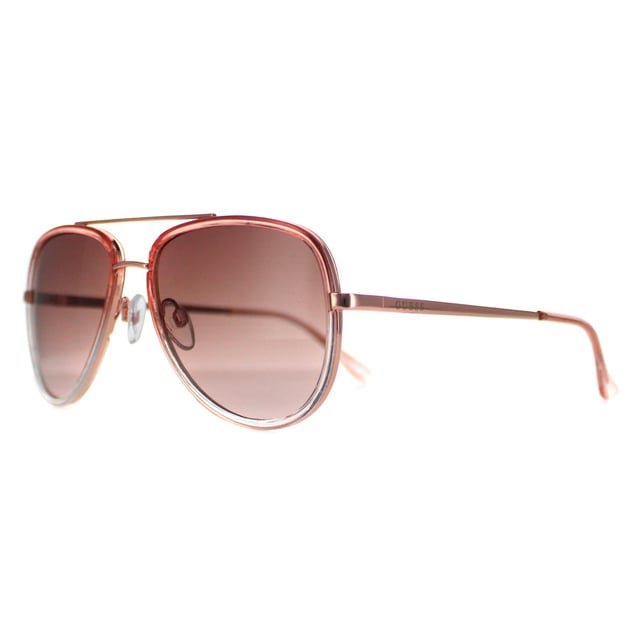 Las gafas de sol Guess Aviator Womens Shiny Pink Smoke Gradient GF0417 son una llamativa silueta de aviador que irradia confianza y estilo, perfecta para hacer una atrevida declaración de estilo. Meticulosamente elaboradas con una montura ligera pero resistente, estas gafas de sol priorizan la comodidad y el estilo duradero, mientras que el icónico logotipo de Guess adorna discretamente las patillas, encarnando una artesanía superior y un gusto refinado. Estas gafas de sol no son sólo un accesorio de moda, sino que ofrecen una protección ocular de primer nivel con lentes de alta calidad que garantizan una magnífica protección contra los rayos UV, aportan claridad y reducen el deslumbramiento.