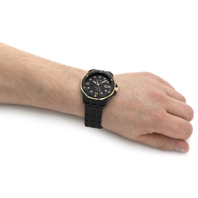 This Bulova Marine Star Analogue Watch for Men is the perfect timepiece to wear or to gift. It's Black 44 mm Round case combined with the comfortable Black Stainless steel watch band will ensure you enjoy this stunning timepiece without any compromise. Operated by a high quality Quartz movement and water resistant to 10 bars, your watch will keep ticking. This sporty luxury design in black ion-plated stainless steel features a black sunray dial with eight individually hand set diamonds and gold-tone accents -The watch has a calendar function: Date, Luminous Hands High quality 21 cm length and 23 mm width Black Stainless steel strap with a Deployment clasp Case diameter: 44 mm,case thickness: 12 mm, case colour: Black and dial colour: Black