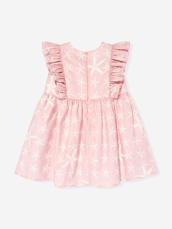 Introducing the Baby Girls Starfish Marina Dress in Pink by Versace, an essential upgrade for your little fashionista‚  AW2024 wardrobe from Italy. Experience the blend of luxury and playfulness. Key features include: Italian Luxury: Impeccably crafted in Italy, synonymous with unparalleled quality. Iconic Starfish Motif: Embellished with a chic starfish print, capturing the essence of whimsical elegance. Premium Fabric: Constructed with the softest fabrics to ensure comfort and ease for all-day wear. Perfect Pink: A vibrant pink hue that complements the playful design, making it a strikingly beautiful garment.revitalise her collection with this stunning designer dress by Versace. Order now for timeless style and unmatched quality!