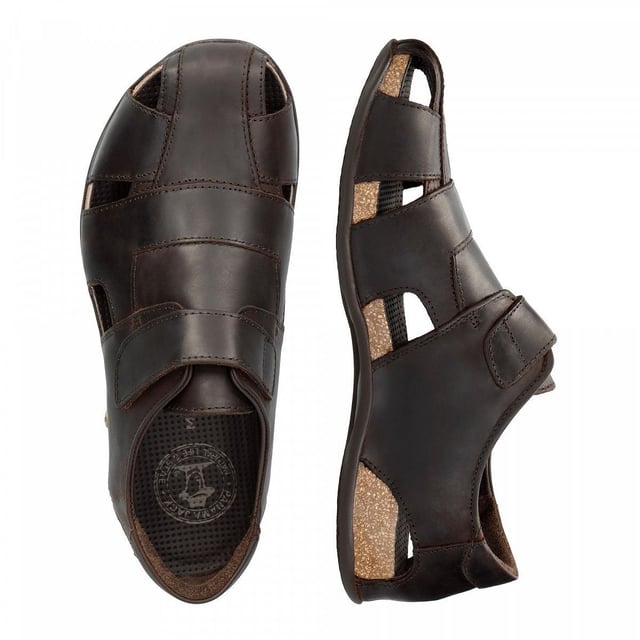 Step into comfort and style with our Panama Jack Men's Leather Sandals, the Fletcher Basic. Crafted for the adventurous soul, these half-open shoes offer a perfect blend of functionality and fashion. Experience unmatched comfort and durability with the Velcro Closure and natural greased nappa leather construction. Enjoy a luxurious feel with leather lining and anatomical insole, providing support and cushioning for all-day wear. Navigate any terrain with confidence, thanks to the flexible and durable TR rubber sole, ensuring stability and grip on outdoor adventures. Bullet Points: Velcro Closure for easy and adjustable fitNatural greased nappa leather construction for durability and styleLeather lining for luxurious comfortAnatomical insole for added supportFlexible and durable TR rubber sole for stability on various surfaces