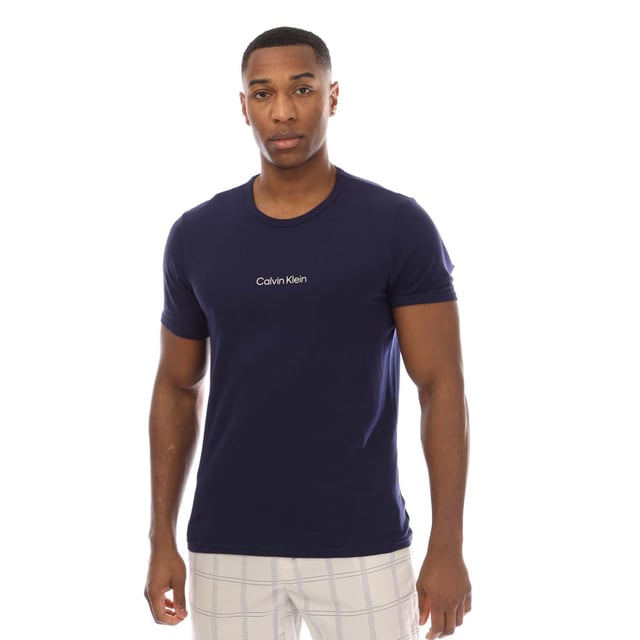 Mens Calvin Klein Shorts Pyjama Set in blue.T-Shirt:- Crewneck.- Short sleeves.- Printed logo.- 57% Cotton  38% Polyester  5% Elastane.Shorts:- Branded elastic waistband.- Side pockets.- Relaxed fit.- 98% Cotton  2% Elastane.- Ref: 000NM2183EO1M
