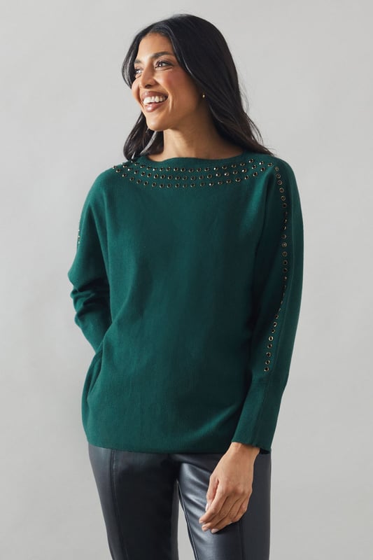Boat neck design for a sophisticated silhouette
        Stud detailing along neckline and shoulders for added glamour
        Relaxed fit through the body for comfort
        Long sleeves for versatile styling
        Ribbed cuffs and hem for a polished finish
    
    This Wallis jumper seamlessly blends comfort with sophistication, making it a versatile addition to your wardrobe. The boat neck design creates an elegant neckline, while the stud detailing adds a touch of glamour to elevate your look. Perfect for casual events or family gatherings, this jumper can be styled effortlessly for various occasions. Pair it with sleek trousers and ankle boots for a chic daytime ensemble, or dress it up with a statement necklace and heels for evening drinks. The relaxed fit ensures all-day comfort without compromising on style, allowing you to feel at ease whether you're running errands or enjoying a leisurely brunch with friends. This jumper is a testament to Wallis' commitment to creating pieces that are both fashionable and functional, catering to the modern woman who values both style and comfort in her everyday attire.