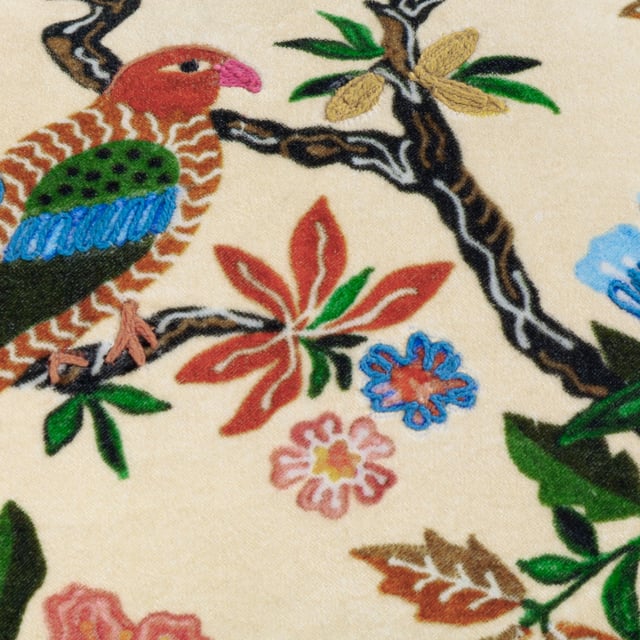 Transform your living space with the Sittacula Embroidered Cushion, where artistry meets sophistication. Featuring a rich velvety base and intricate embroidered detailing, this cushion brings to life a majestic bird nestled among lush foliage, evoking the serenity of tropical escapism. The printed face design, with its vivid textures and delicate stitching, merges harmoniously with a minimalist reverse side, offering versatility for your decor. Whether placed on a sofa or an accent chair, this cushion adds a refined yet relaxed touch, perfect for anyone who treasures nature-inspired details and the timeless allure of pattern and print.