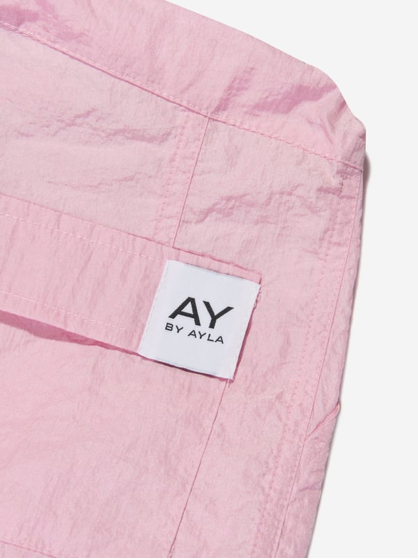 Dream big and feel fab with these girls pink woven cargo pants from AY by Ayla. The stylish and dramatic piece offers a light weight designed to look good with every move. Dance, jump and twirl with effect thanks to an on-trend aesthetic straight out of a music video. Pair with the label's sleeveless knit top for a cool and chic look. Elasticated Toggle Waistband 2 Side Pockets 2 Cargo Pockets 2 Back Pockets