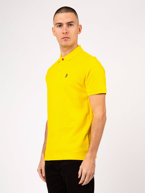 Complete your everyday look with this polo top from LUKE. Crafted from a luxury cotton pique, it's cut to a relaxed fit with a three button placket and features a soft rib collar and cuff. It is complete with the brand's iconic lion head embroidery on the left