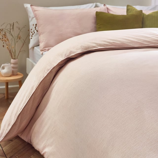 Minimalist yet modern, the Heaton Stripe duvet cover set is ideal for those who adore the relaxed-living aesthetic. Featuring a subtly textured, striped design, this 100% tumbled cotton bedding is complete with twin-needle stitch edging. Crafted from ultra-cosy, breathable fabric, this duvet set will become much softer with every wash! This product is certified by OEKO-TEX® MADE IN GREEN showing it has been sustainably made.