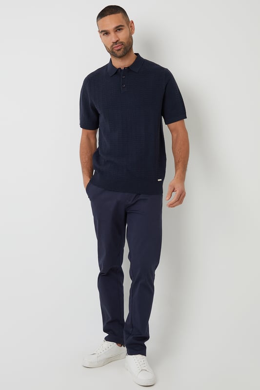 Add an easy-to-wear staple to your transitional wardrobe with this Threadbare button up knitted polo.
With an open collar fashioned with button up detail, this short sleeve knitted polo has small ribbed cuffs to the sleeve and a ribbed hem for comfort and ease.
In a textured stitch to the body to make it the perfect transitional piece for in-between weather, and finished with a metal branded tab above the hem.
Pair it with chinos or denim jeans and a smart coat for day-to-day wear that also works perfect for date night, or team with shorts for summer style.