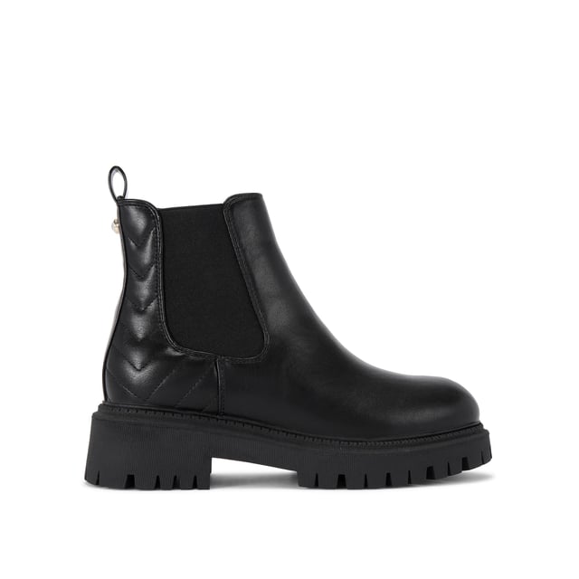 This Carvela Ace Chelsea ankle boot features a black upper with chevron overstitch quilting at the back of the ankle. There is a crystal stud at the back of the ankle with a small patent pull tab.