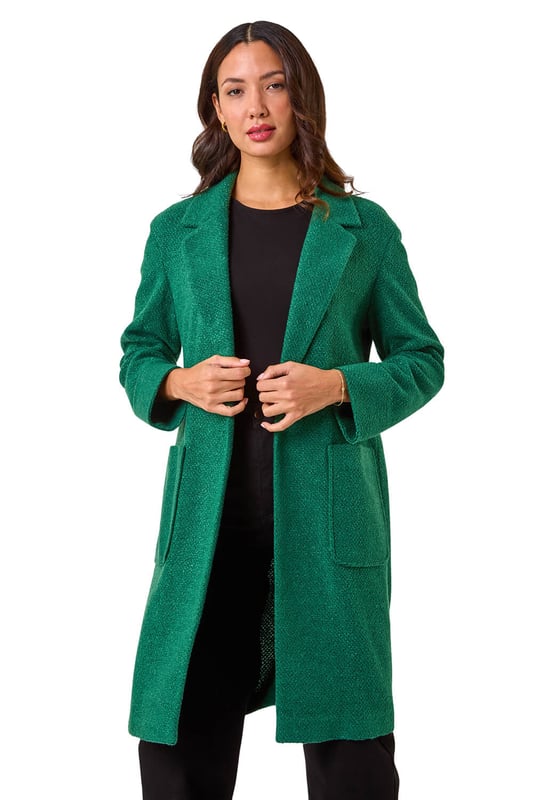 Boucle Knit Longline Coatigan from Roman. Add a timeless classic to your collection with this coatigan. Designed in a classic longline shape this piece features a relaxed rever collar, edge to edge opening and cosy full-length sleeves. This coatigan is the perfect addition to your wardrobe for the transitional season. Dress it up or down to suit any occasion, this versatile piece also features patch pockets. Pair this jacket with a pair of jeans and a high-neck jumper for an ultra-cosy finish!